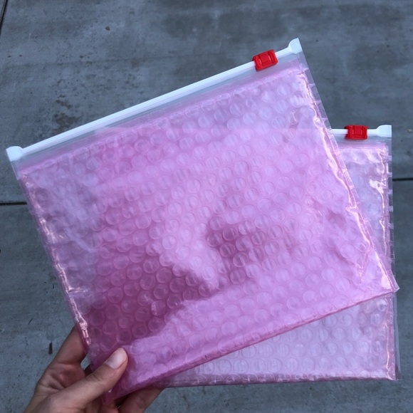 Glossier Other - 2 Glossier pink bubble zip pouches